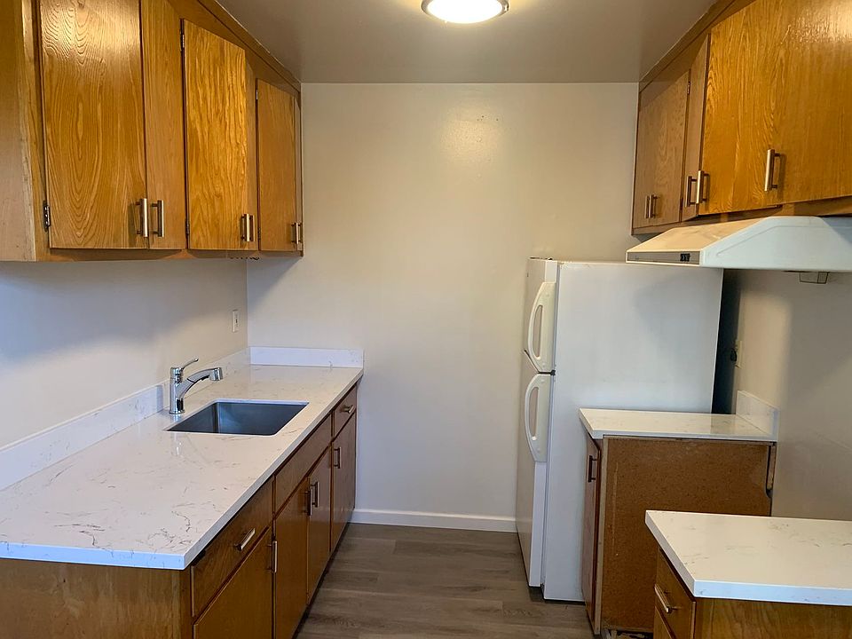 Kitchen with new floors/counters.