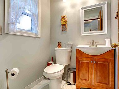 The powder room has a new vanity, sink, faucets & toilet. 