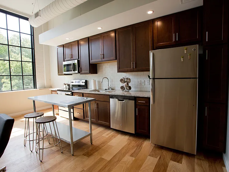 Kitchen with espresso cabinets and stainless appliances
