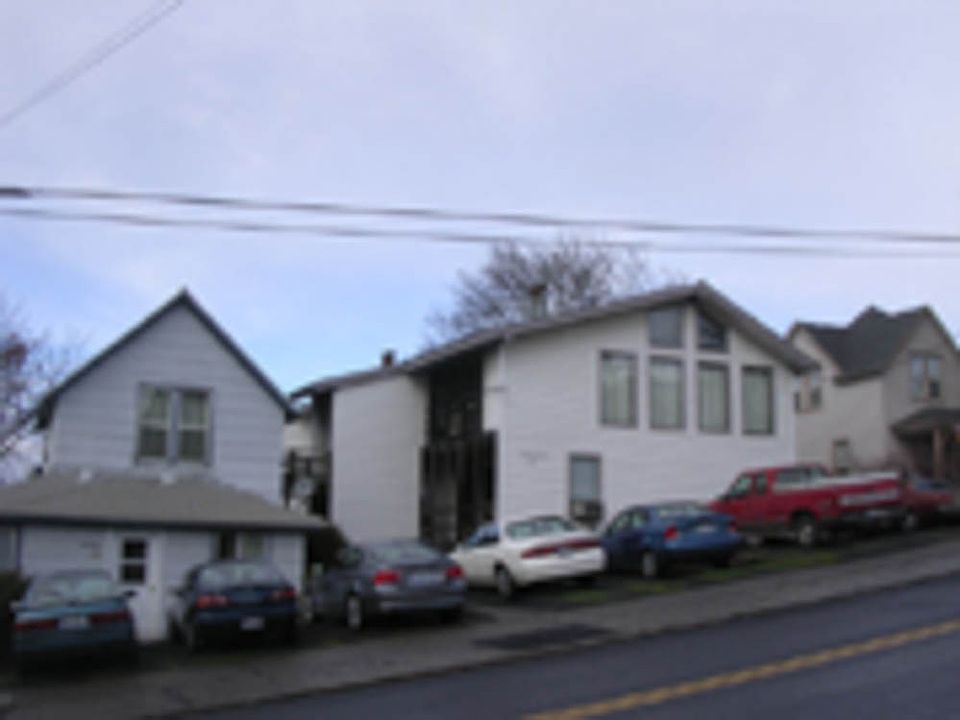 Apartments are in the larger building at right in the photo.