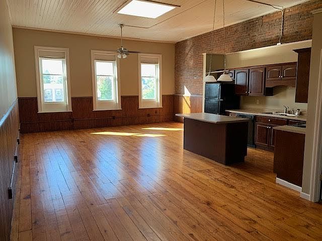 Beautiful, original flooring, brick wall and wainscotting. Has a skylight for lots of natural light.