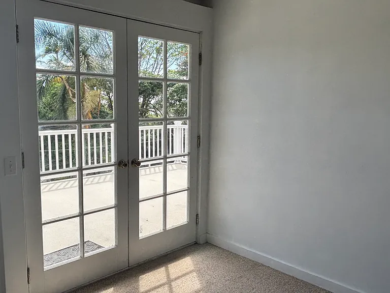 French doors lead out to front lanai and share the ocean views.