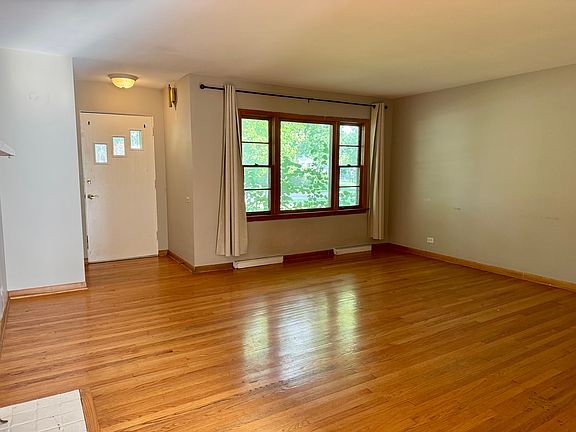 Entrance with living room - oak hardwood flooring throughout.
