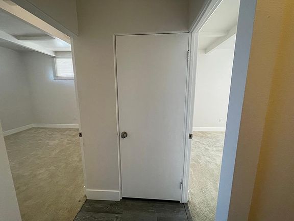 Hallway closet in between two bedrooms.