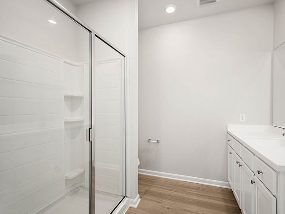 Pamper yourself in the master bathroom featuring a soaking tub and step in shower.