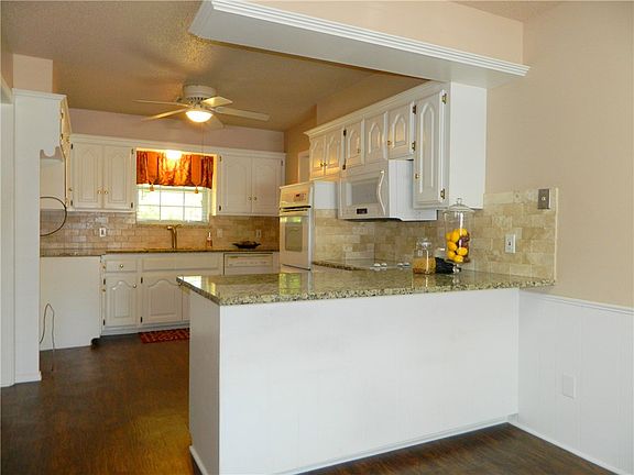 Kitchen with remodeled kitchen and chiseled granite counter tops