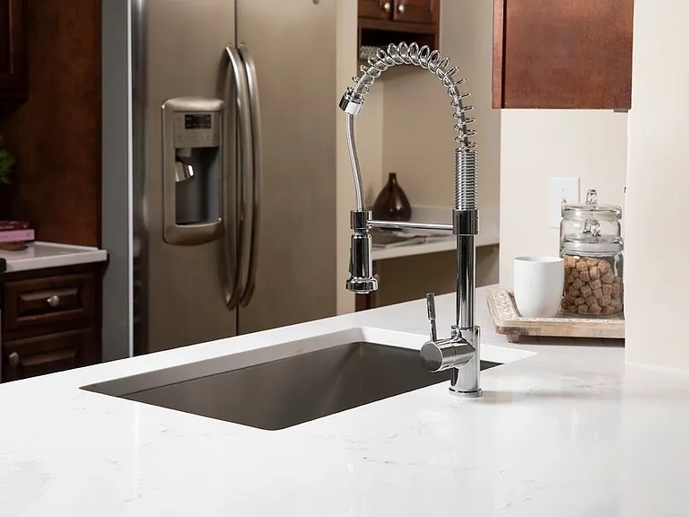 Vicostone Marble-Effect Quartz Counters, Deep Farmhouse-style sink with single handle sprayer faucet
