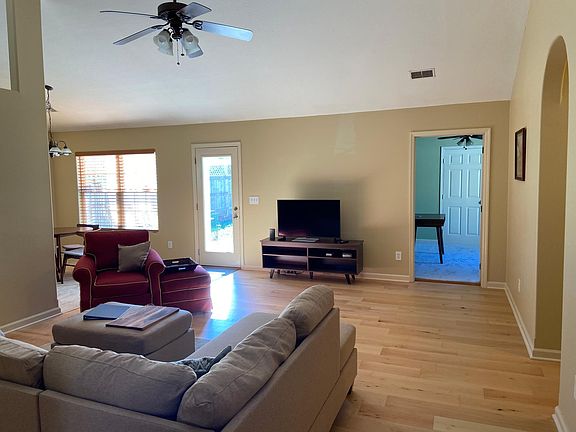 Living room with vaulted ceilings.