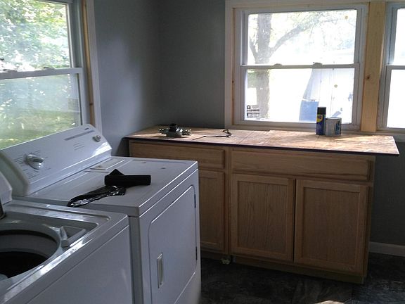 Back porch with washer and dryer.