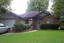 View from the Curb! Beautifully Landscaped!