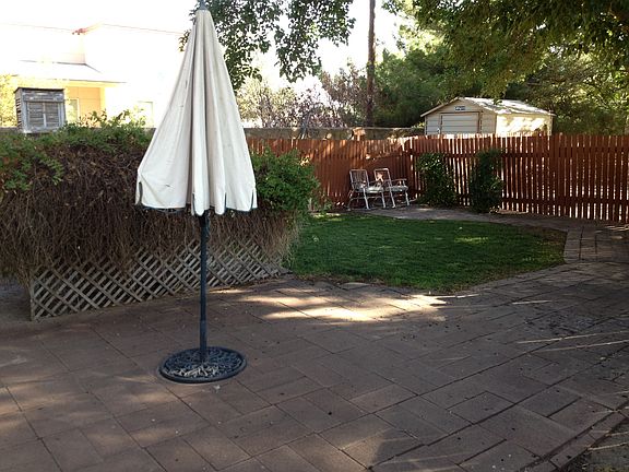 Room opens into fenced backyard