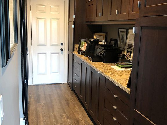 Extra Pantry Space, Door Leads to Garage & Barn Door for Bathroom