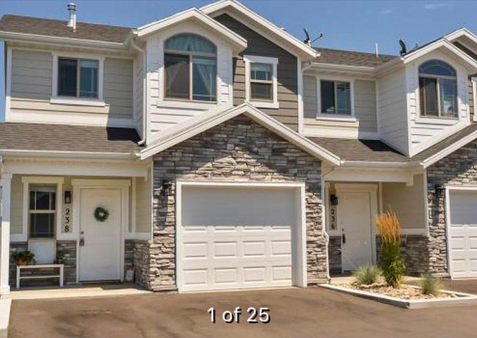 Exterior, located on end unit with plenty of grass to the side and behind the home.