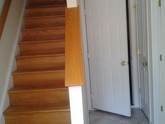 Foyer leading to garage and bedroom 1