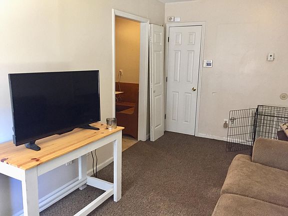 Living room *** Top two apartments connect through a hallway behind the door on the right.