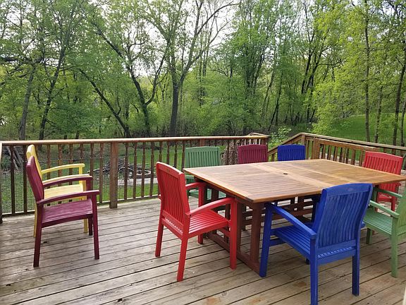 Spacious deck facing wooded area.