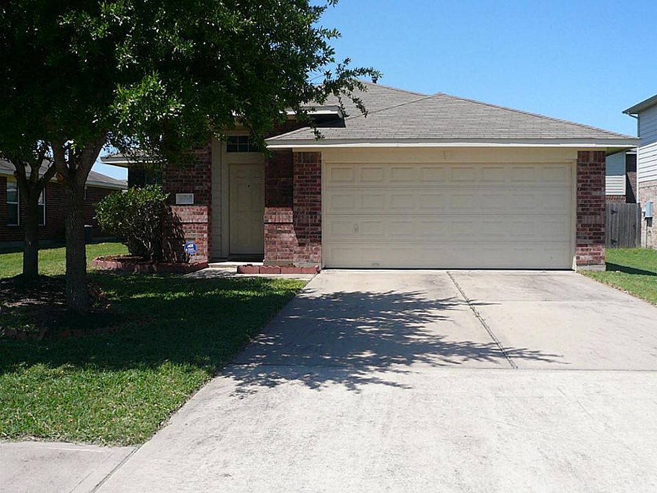 Lovely home has a great yard for the kids and pets with shady trees.