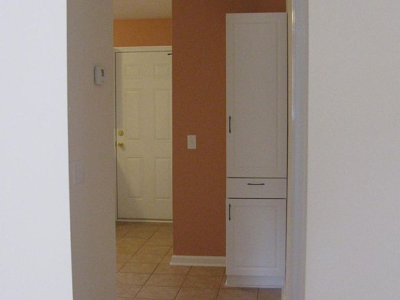 Hallway to bedroom & kitchen & back door.


