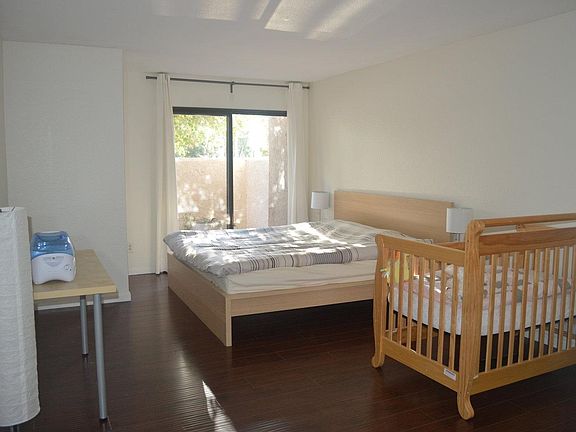 Spacious master bedroom with patio balcony