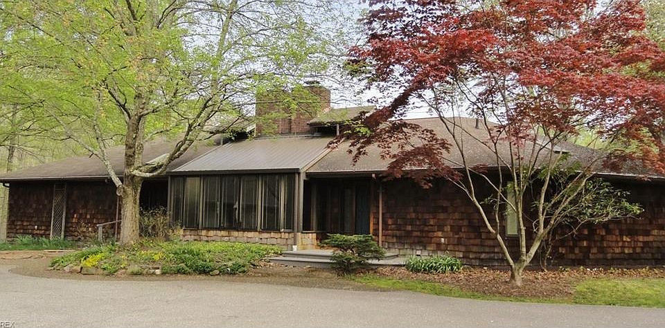 Front view unique all cedar 1-owner home