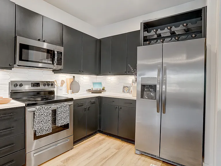 Kitchen with Quartz Countertop and Stainless Steel Appliances.
