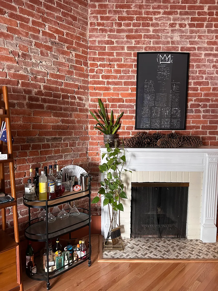 Exposed brick and beautiful mantle with original fireplace. - 1414 15th St NW #2