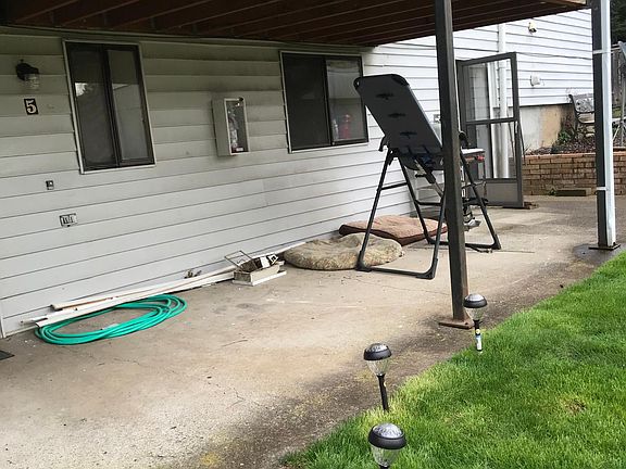 The unit starts inside about where the fire extinguisher is and runs beyond the brick wall a little.