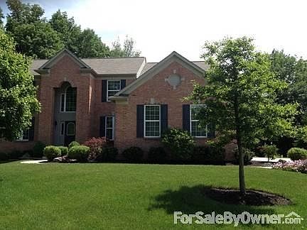 Front of house, two trees
						:
						House sits on a slight hill