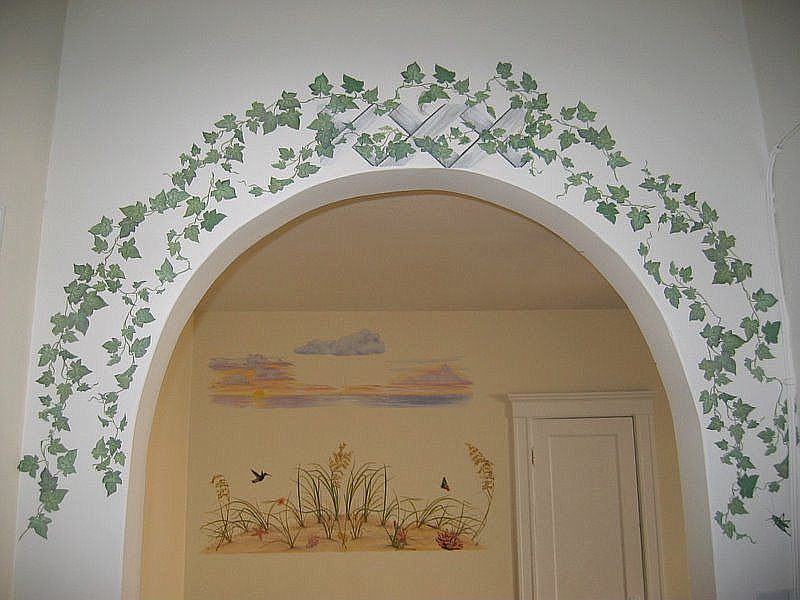 MediterraneanEntryArchway upon entry; acter; with murals of ivy above it.