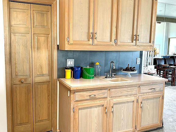 Kitchen pantry & wet bar in spacious open plan dining area.