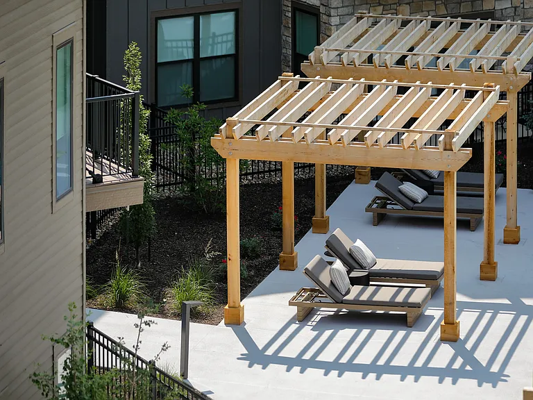 LOUNGE SEATING UNDER SHADDED PERGOLA