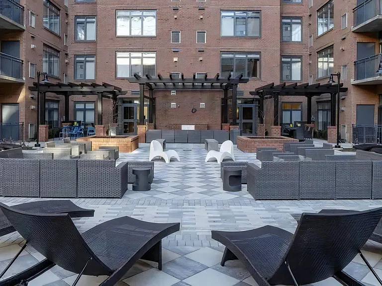 Courtyard With Outdoor Kitchens, Fire Pits, and Pergola Seating