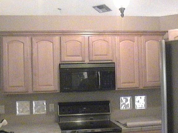cabinets over new stove and microwave
