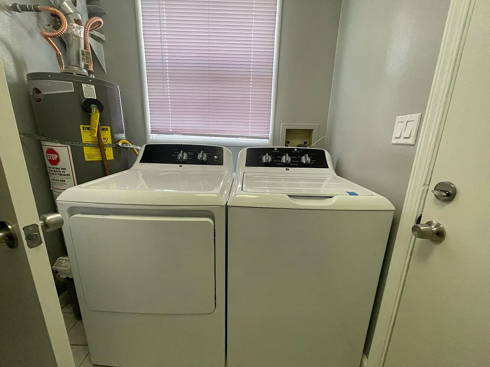 Laundry room with new washer & dryer