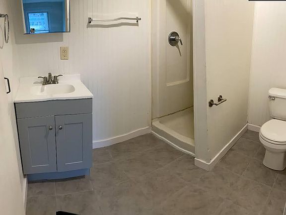 New bathroom floors, stand up shower only.