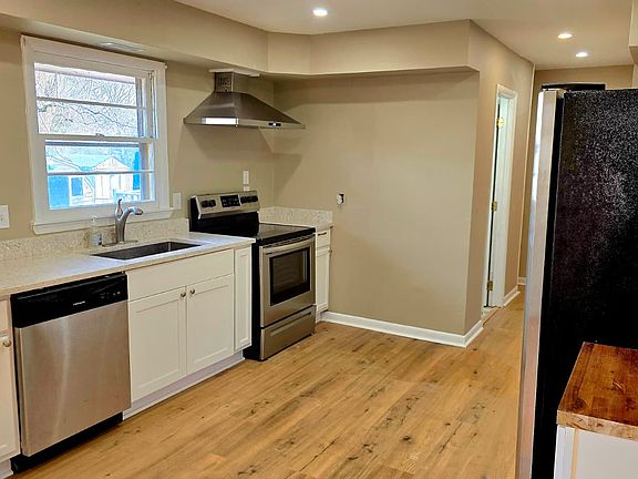 Gorgeous kitchen boasts granite and butcher block counter tops, extra large sink, stainless steel appliances and ample storage.