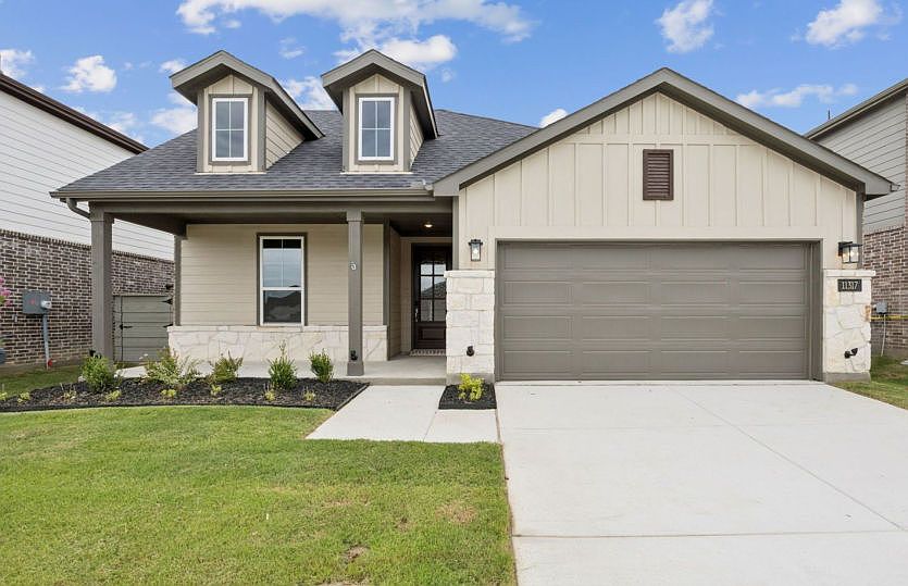 The Emory, a one-story home with 2-car garage, shown with Home Exterior 41
