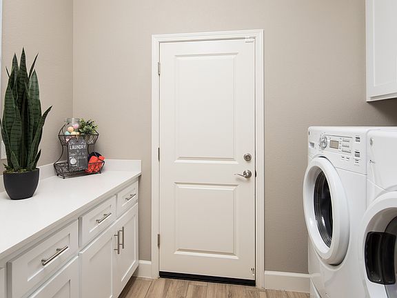 Laundry room with cabinet space