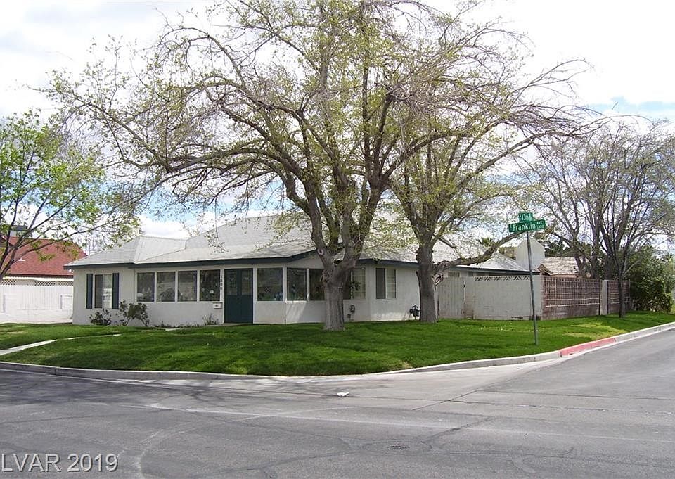 Corner lot with beautiful lawns and shady trees!