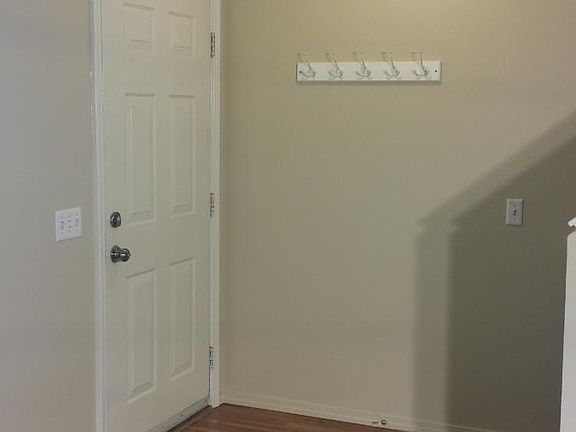 Entry with new flooring, coat rack, nickel everything