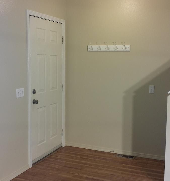 Entry with new flooring, coat rack, nickel everything
