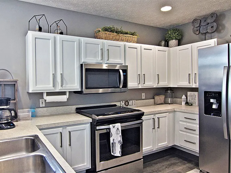 White shaker cabinetry with Brushed Nickel Hardware*