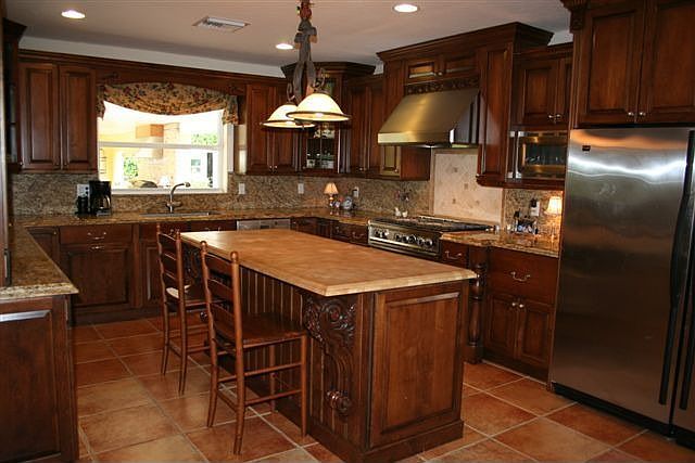 kitchen with solid wood cabinets and granite counter tops; wonderful island