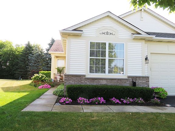 Front view with 2 car attached garage