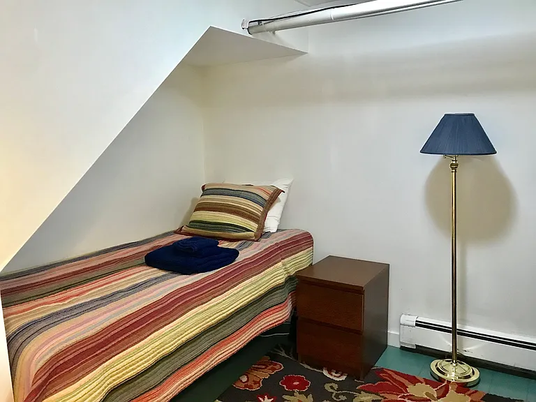 This is one of the two bedrooms. There is a SINGLE bed, bureau and closet in the space, there is no room to bring your own bed or personal furniture.