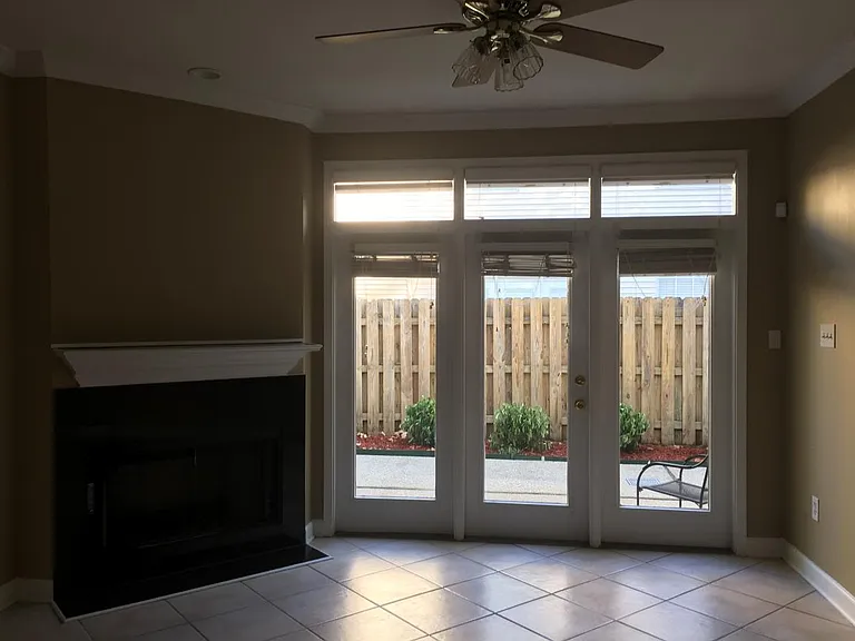 Living room with view of back patio.