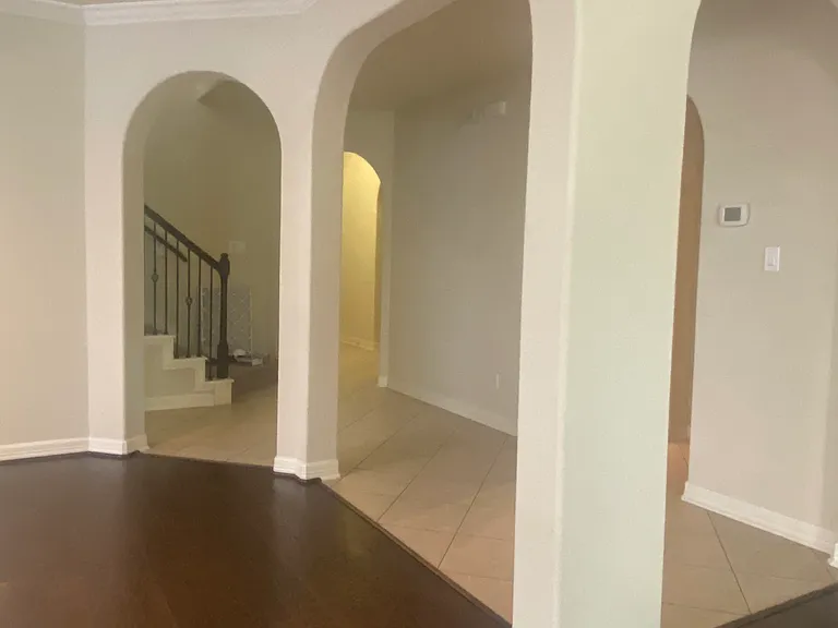 Elegant archways throughout the main floor create a seamless flow between common areas and hallways.