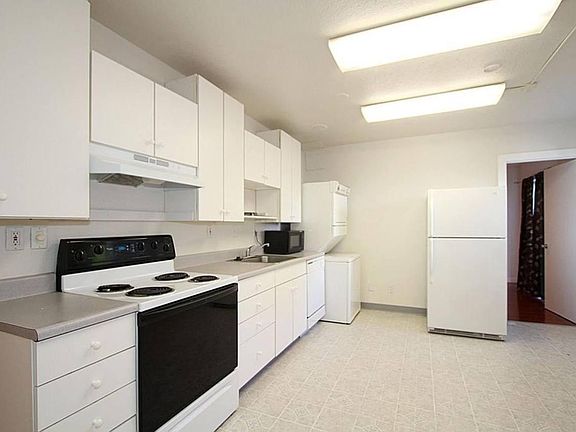 Functional kitchen with ample storage and a layout that provides separation between living spaces