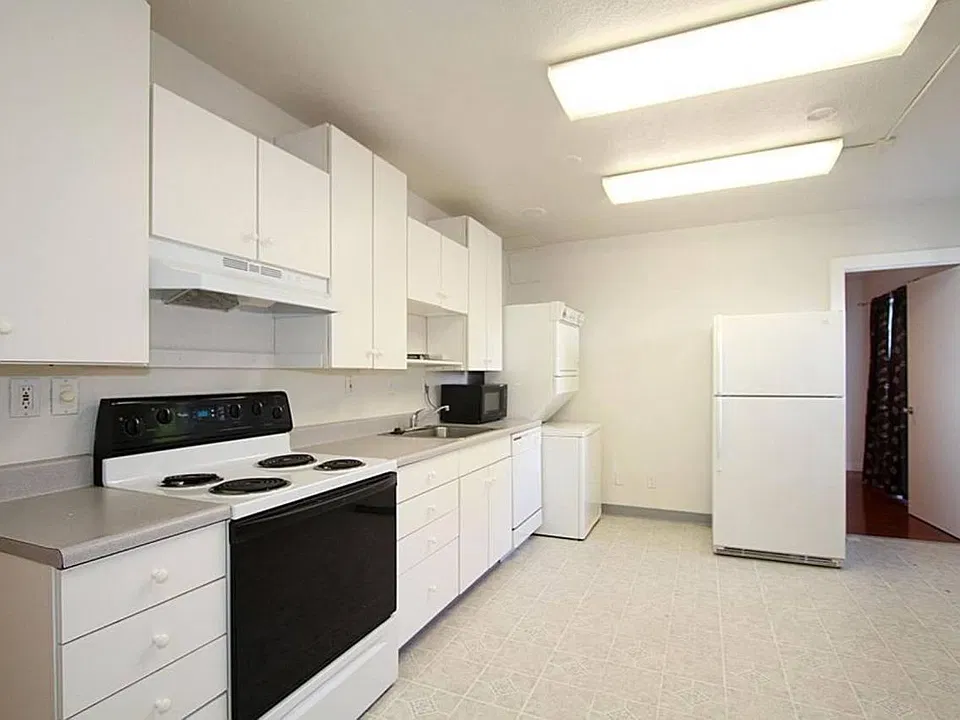 Functional kitchen with ample storage and a layout that provides separation between living spaces