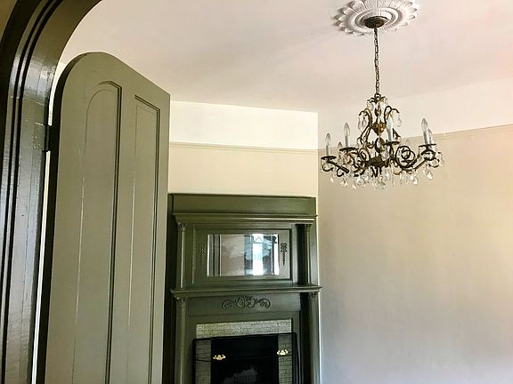 Parlor, had double doors and chandlier